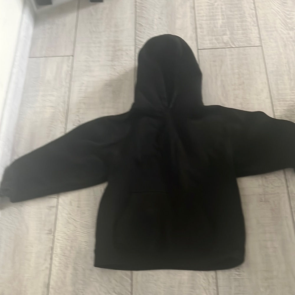 This sweatshirt is black and warm